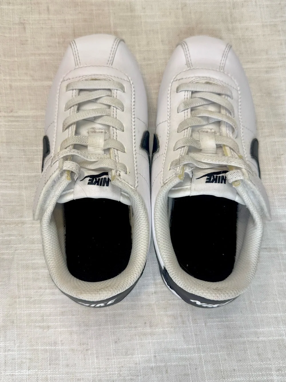 Nike Kids White Sneakers with Black Swoosh